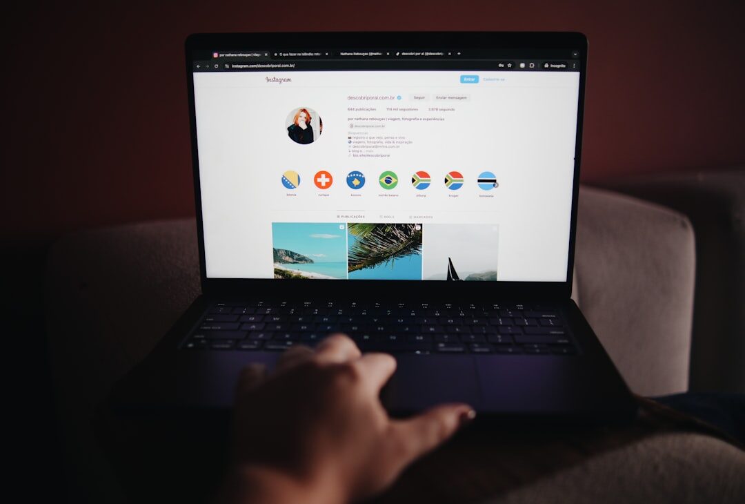 person using laptop with social icons